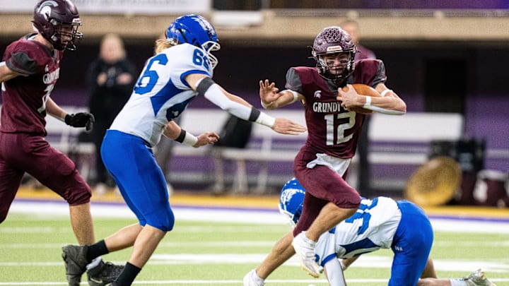 Grundy Center's Judd Jirovsky (12) runs the ball against Dike-New Hartford on Thursday, Nov. 21, 2024, at the UNI-Dome in Cedar Falls, IA. Grundy Center's Judd Jirovsky (12) runs the ball against Dike-New Hartford on Thursday, Nov. 21, 2024, at the UNI-Dome in Cedar Falls, IA.