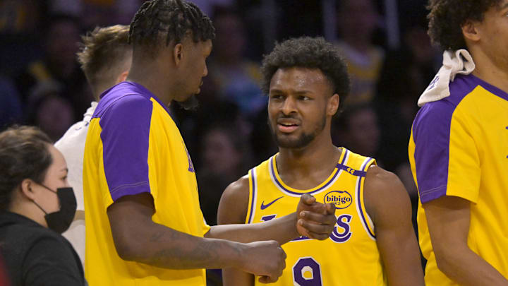 Mar 19, 2025; Los Angeles, California, USA: Los Angeles Lakers guard Bronny James (9) talks with forward Dorian Finney-Smith (17) during a time out in the second half against the Denver Nuggets at Crypto.com Arena. Mandatory Credit: Jayne Kamin-Oncea-Imagn Images