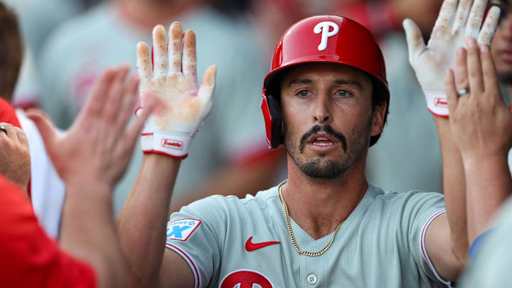 Mar 14, 2025; Tampa, Florida, USA; Philadelphia Phillies catcher Garrett Stubbs (21) celebrates after scoring a run against the New York Yankees in the second inning during spring training at George M. Steinbrenner Field.