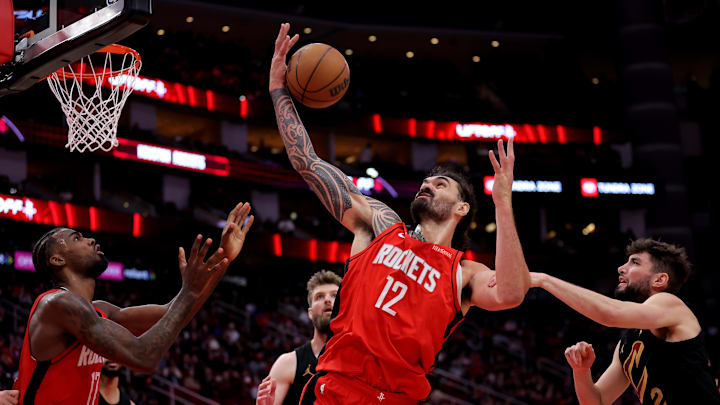 Jan 22, 2025; Houston, Texas, USA; Houston Rockets center Steven Adams (12) rebounds against the Cleveland Cavaliers during the fourth quarter at Toyota Center. Mandatory Credit: Erik Williams-Imagn Images