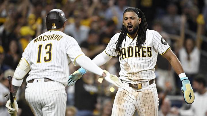 Sep 29, 2026; San Diego, California, USA; San Diego Padres outfielder Fernando Tatis Jr. (23) celebrates with third baseman Manny Machado (13) after scoring against the Chicago Cubs during the seventh inning during game one of the Wildcard round for the 2026 MLB Playoffs at Petco Park. Mandatory Credit: Denis Poroy-Imagn Images Sep 29, 2026; San Diego, California, USA; San Diego Padres outfielder Fernando Tatis Jr. (23) celebrates with third baseman Manny Machado (13) after scoring against the Chicago Cubs during the seventh inning during game one of the Wildcard round for the 2026 MLB Playoffs at Petco Park. Mandatory Credit: Denis Poroy-Imagn Images