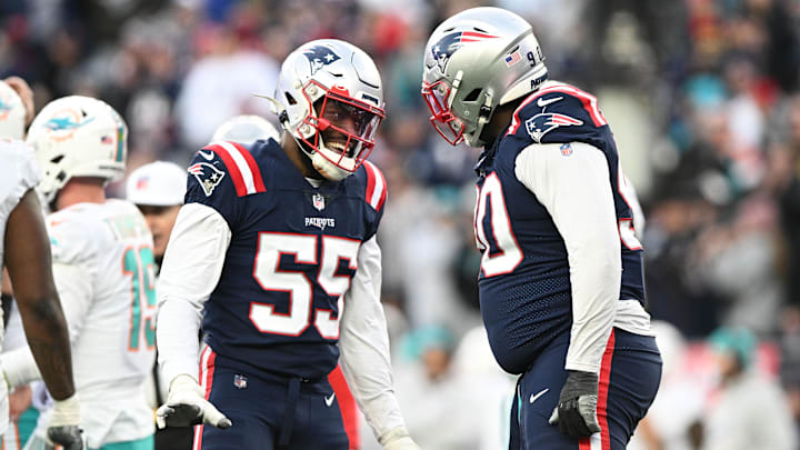 Jan 1, 2023; Foxborough, Massachusetts, USA; New England Patriots linebacker Josh Uche (55) reacts with defensive tackle Christian Barmore (90) after a sack against the Miami Dolphins during the second half at Gillette Stadium. Mandatory Credit: Brian Fluharty-Imagn Images