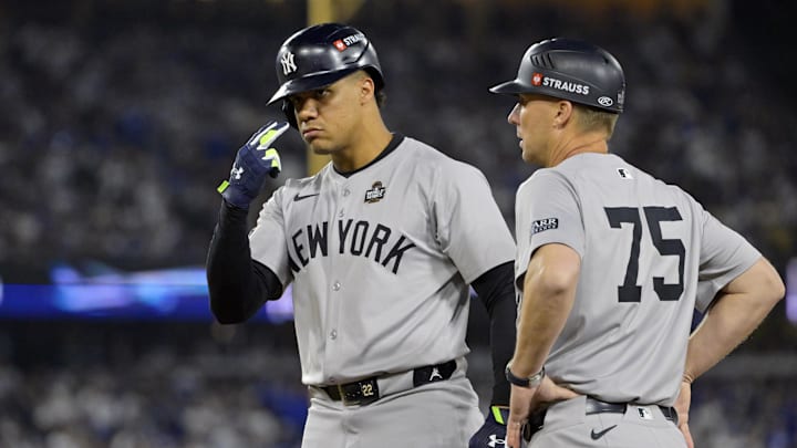 Oct 26, 2024; Los Angeles, California, USA; New York Yankees outfielder Juan Soto (22) reacts at first base after hitting a single in the ninth inning against the Los Angeles Dodgers during game two of the 2024 MLB World Series at Dodger Stadium. Mandatory Credit: Jayne Kamin-Oncea-Imagn Images