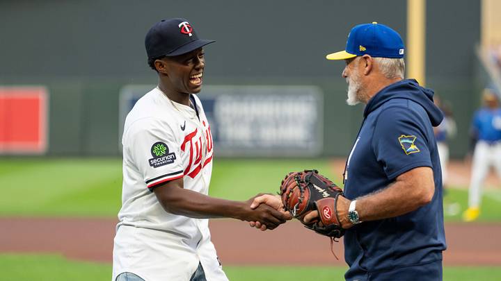 Jul 24, 2026; Minneapolis, Minnesota, USA; Minnesota Twins 2026 first-round draft pick Vahn Lackey throws out a first pitch to manager Derek Shelton (8) prior to the game against the Athletics at Target Field. Mandatory Credit: Jordan Johnson-Imagn Images