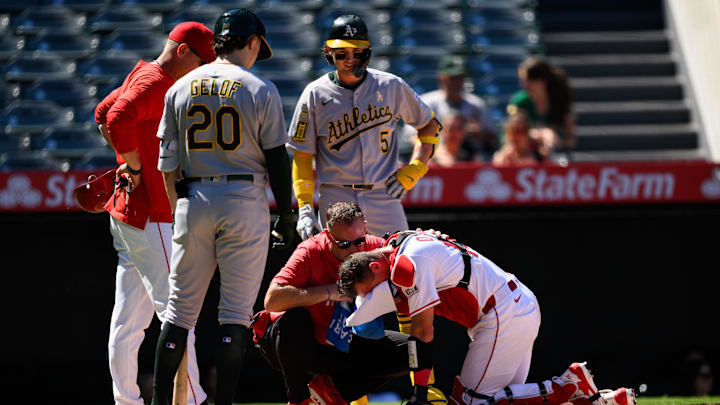 Sep 7, 2025; Anaheim, California, USA; Los Angeles Angels catcher Logan O'Hoppe (14) is tended to after being hit by a ball during the seventh inning against the Athletics at Angel Stadium. Mandatory Credit: William Liang-Imagn Images Sep 7, 2025; Anaheim, California, USA; Los Angeles Angels catcher Logan O'Hoppe (14) is tended to after being hit by a ball during the seventh inning against the Athletics at Angel Stadium. Mandatory Credit: William Liang-Imagn Images