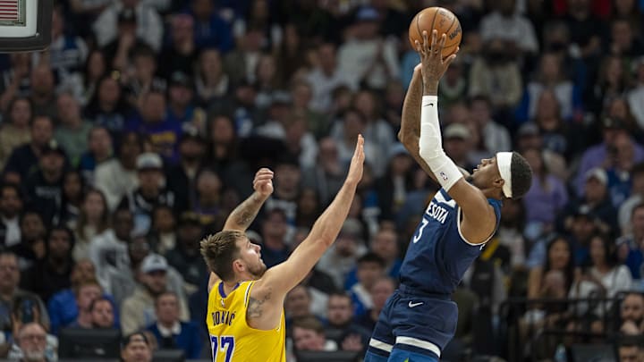 Minnesota Timberwolves forward Jaden McDaniels shoots the ball over Los Angeles Lakers guard Luka Doncic in the first half during Game 3 of their first-round playoff series at Target Center in Minneapolis on April 25, 2025. 