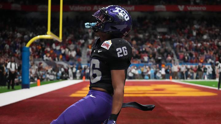 Dec 30, 2025; San Antonio, TX, USA; TCU Horned Frogs running back Jeremy Payne (26) scores on a 35-yard touchdown reception in overtime for the winning score against the Southern California Trojans during the Alamo Bowl at Alamodome. Mandatory Credit: Kirby Lee-Imagn Images Dec 30, 2025; San Antonio, TX, USA; TCU Horned Frogs running back Jeremy Payne (26) scores on a 35-yard touchdown reception in overtime for the winning score against the Southern California Trojans during the Alamo Bowl at Alamodome. Mandatory Credit: Kirby Lee-Imagn Images
