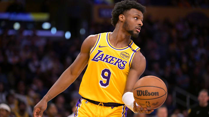 Mar 19, 2025; Los Angeles, California, USA;  Los Angeles Lakers guard Bronny James (9) inbound the ball in the second half against the Denver Nuggets at Crypto.com Arena. Mandatory Credit: Jayne Kamin-Oncea-Imagn Images