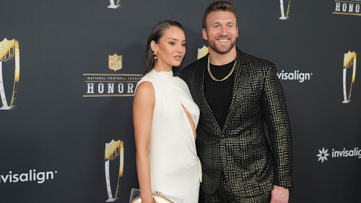 Kyle Juszczyk and his wife Kristin Juszczyk on the red carpet before Super Bowl LIX NFL Honors at Saenger Theatre.