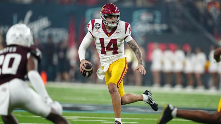 Dec 27, 2024; Las Vegas, NV, USA; Southern California Trojans quarterback Jayden Maiava (14) throws the ball against the Texas A&M Aggies in the first half at Allegiant Stadium. 