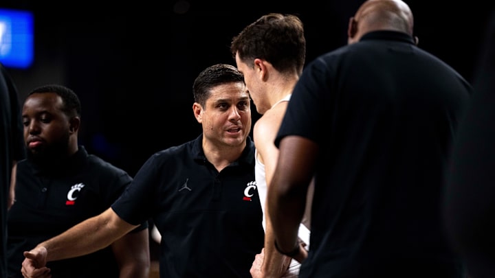 Cincinnati Bearcats guard Connor Hickman (8) listens to instructions from UC head coach Wes Miller in the Wednesday, Nov. 27 win over Alabama State. Cincinnati Bearcats guard Connor Hickman (8) listens to instructions from UC head coach Wes Miller in the Wednesday, Nov. 27 win over Alabama State.