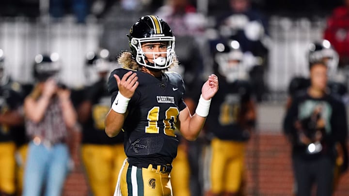 Oct 20, 2023; Carrollton, GA, USA; Carrollton Trojans quarterback Julian Lewis (10) reacts to a pass against the Westlake Lions during the first half at Grisham Stadium. The 15-year-old Carrollton High student has already committed to playing for the University of Southern California Trojans and has been considered one of the top high school quarterback prospects. Mandatory Credit: John David Mercer-Imagn Images Oct 20, 2023; Carrollton, GA, USA; Carrollton Trojans quarterback Julian Lewis (10) reacts to a pass against the Westlake Lions during the first half at Grisham Stadium. The 15-year-old Carrollton High student has already committed to playing for the University of Southern California Trojans and has been considered one of the top high school quarterback prospects. Mandatory Credit: John David Mercer-Imagn Images