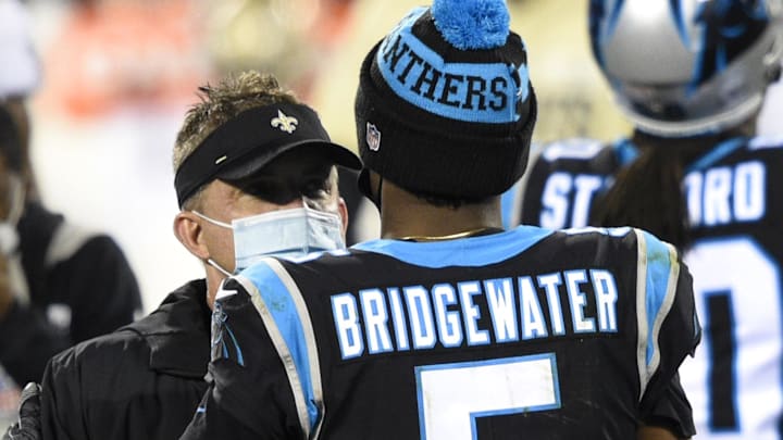 Jan 3, 2021; Charlotte, North Carolina, USA; Carolina Panthers quarterback Teddy Bridgewater (5) with New Orleans Saints head coach Sean Payton after the game at Bank of America Stadium. Mandatory Credit: Bob Donnan-Imagn Images