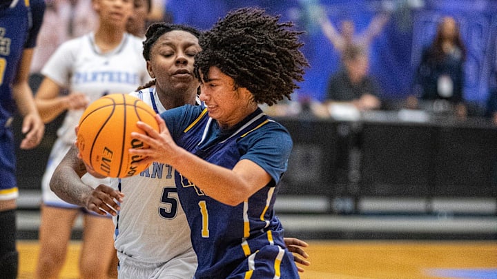 Winter Haven Blue Devils (1) Jaeden Williams drives by Dr. Phillips Panthers (5) Trinity Turner during the FHSAA 7A Girls State semifinal game at the RP Funding Center in Lakeland Fl. Friday March 8, 2024. Winter Haven fell 65-62 to Dr. Phillips.
Ernst Peters/The Ledger
