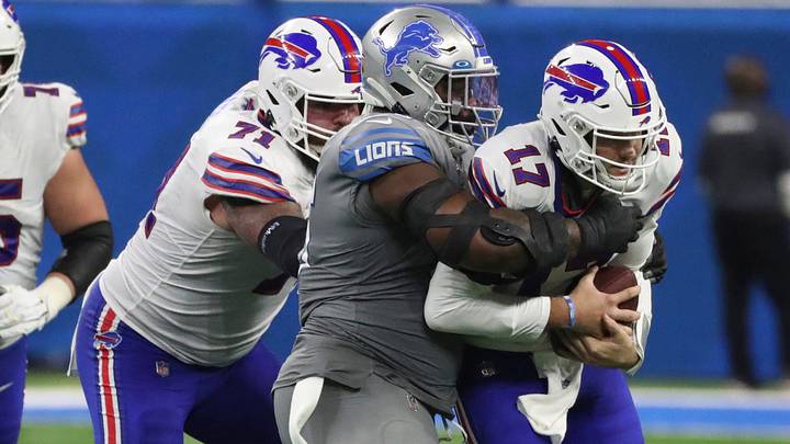 Detroit Lions' defensive tackle Benito Jones (center) sacks Buffalo Bills' quarterback Josh Allen (17) during the second half of the Lions' 28-25 loss on Thursday, Nov. 24, 2022, at Ford Field. Detroit Lions' defensive tackle Benito Jones (center) sacks Buffalo Bills' quarterback Josh Allen (17) during the second half of the Lions' 28-25 loss on Thursday, Nov. 24, 2022, at Ford Field.