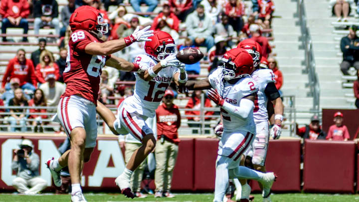 Oklahoma defensive back Derrick Johnson II breaks up a pass intended for tight end Hayden Hansen in the spring game.