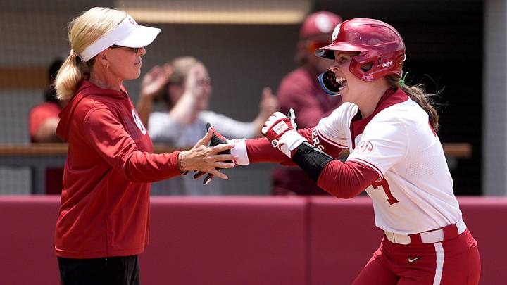 Oklahoma's Kasidi Pickering (7) celebrates a home run with head coach Patty Gasso in the third inning during Game 1 of the NCAA Norman Super Regional softball game between the Mississippi State Bulldogs and the University of Oklahoma Sooners at Love's Field in Norman, Okla., May, 22, 2026. Mississippi State won 11-9. Oklahoma's Kasidi Pickering (7) celebrates a home run with head coach Patty Gasso in the third inning during Game 1 of the NCAA Norman Super Regional softball game between the Mississippi State Bulldogs and the University of Oklahoma Sooners at Love's Field in Norman, Okla., May, 22, 2026. Mississippi State won 11-9.