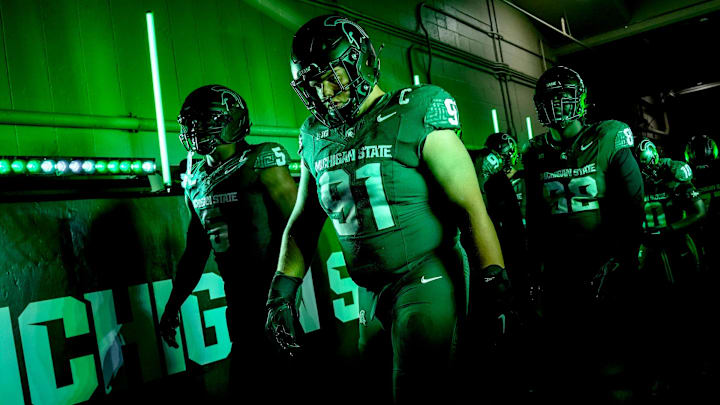 Michigan State's Alex VanSumeren, right, and Jordan Hall, left, walk to the field before the game against Michigan on Saturday, Oct. 25, 2025, at Spartan Stadium in East Lansing.