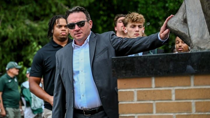 Michigan State's head coach Jonathan Smith touches the foot of the Sparty statue before the game against Florida Atlantic on Friday, Aug. 30, 2024, outside Spartan Stadium in East Lansing. Michigan State's head coach Jonathan Smith touches the foot of the Sparty statue before the game against Florida Atlantic on Friday, Aug. 30, 2024, outside Spartan Stadium in East Lansing.
