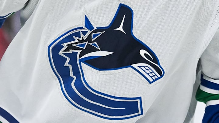 Nov 12, 2023; Montreal, Quebec, CAN; View of a Vancouver Canucks logo on a jersey worn by a member of the team against the Montreal Canadiens during the second period at Bell Centre. Mandatory Credit: David Kirouac-Imagn Images