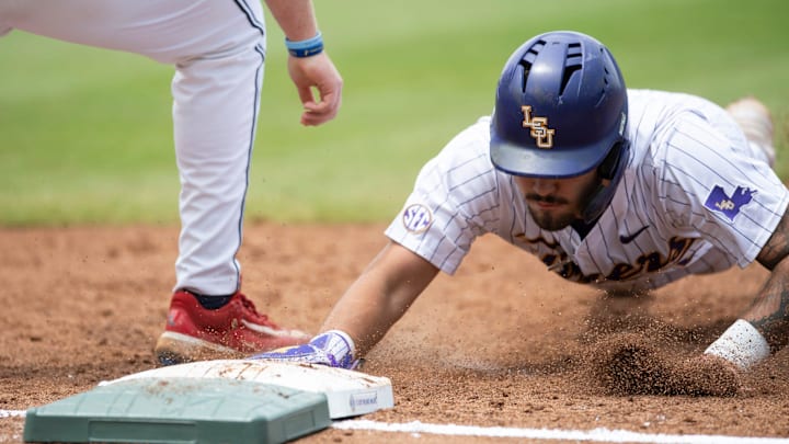 LSU Tigers' Cade Arrambide (0) dives safely back into first base as Ole Miss Rebels take on LSU Tigers during the SEC baseball tournament at Hoover Met in Birmingham, Ala., on Saturday, May 24, 2025.
