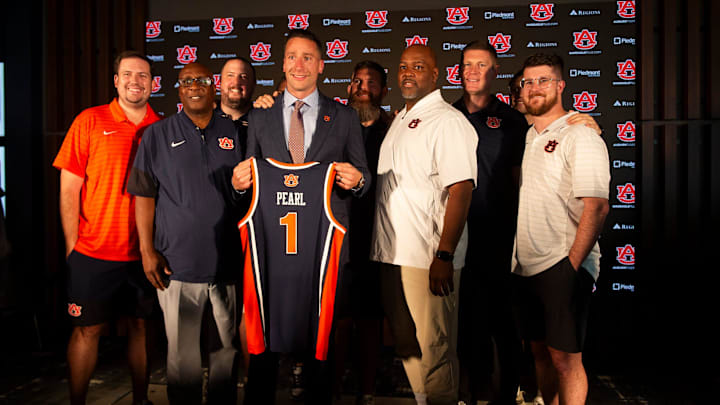 Steven Pearl poses with his coach staff as he is introduced as the new Auburn men’s basketball head coach at the Woltosz Performance Center in Auburn, Ala. on Wednesday, Sept. 24, 2025.