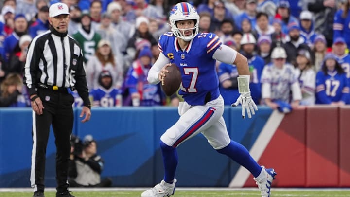 Buffalo Bills quarterback Josh Allen rolls out looking to throw the ball against the New York Jets.