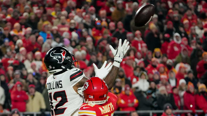 Dec 7, 2025; Kansas City, Missouri, USA; Houston Texans wide receiver Nico Collins (12) catches a pass against Kansas City Chiefs cornerback Trent McDuffie (22) during the first quarter at GEHA Field at Arrowhead Stadium. Mandatory Credit: Denny Medley-Imagn Images