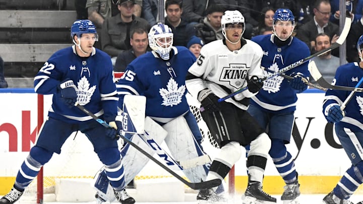 Nov 13, 2025; Toronto, Ontario, CAN;  Los Angeles Kings forward Quintin Byfield (55) screens Toronto Maple Leafs goalie Dennis Hildeby (35) as defensemen Jake McCabe (22) and Simon Benoit (2) track the play in the third period at Scotiabank Arena. Mandatory Credit: Dan Hamilton-Imagn Images