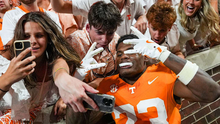 Tennessee defensive back Boo Carter (23) takes a selfie with fans during a SEC conference game between Tennessee and Florida in Neyland Stadium on Saturday, Oct. 12, 2024. Tennessee defensive back Boo Carter (23) takes a selfie with fans during a SEC conference game between Tennessee and Florida in Neyland Stadium on Saturday, Oct. 12, 2024.