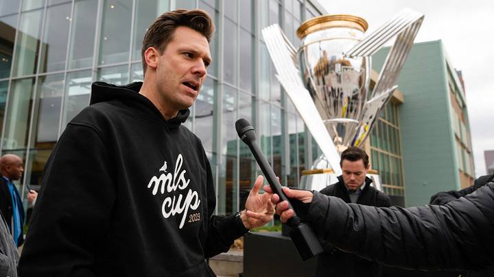 Dec 6, 2023; Columbus, OH, USA; Chief of strategy and corporate development at Haslam Sports Group, Josh Glessing speaks to media during a Major League Soccer event to celebrate the arrival of the 2023 MLS Cup presented by Audi in Columbus, Ohio with a giant replica of The Philip F. Anschutz Trophy in the Short North. Mandatory Credit: Adam Cairns-USA TODAY Sports