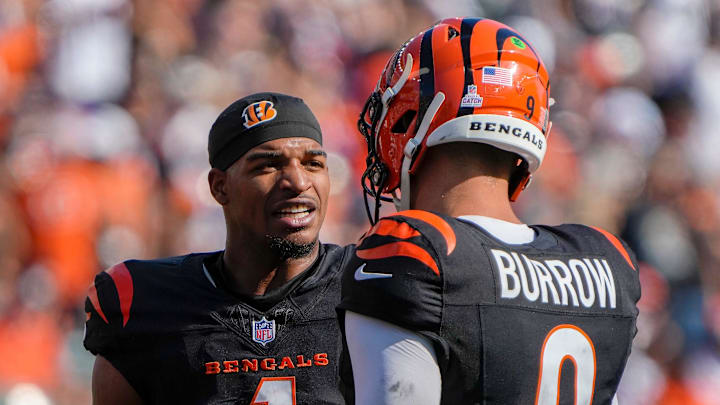 Cincinnati Bengals wide receiver Ja'Marr Chase (1) and quarterback Joe Burrow (9) talk during a timeout in Sunday, October 6, 2024, at Payor Stadium. The Bengals lost to the Baltimore Ravens 41-38 in overtime.