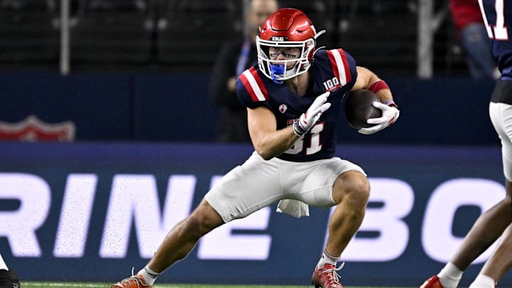 East wide receiver Efton Chism of Eastern Washington (81) runs with the ball during the first half against the West at AT&T Stadium