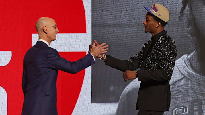 Jun 26, 2024; Brooklyn, NY, USA; Ron Holland II shakes hands with NBA commissioner Adam Silver after being selected in the first round by the Detroit Pistons i: Brad Penner-Imagn Images
