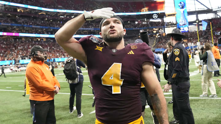 Arizona State running back Cam Skattebo (4) blows a kiss toward fans after Texas won 39-31 in double overtime in the Chick-fil-A Peach Bowl in Atlanta on Jan. 1, 2025. Arizona State running back Cam Skattebo (4) blows a kiss toward fans after Texas won 39-31 in double overtime in the Chick-fil-A Peach Bowl in Atlanta on Jan. 1, 2025.