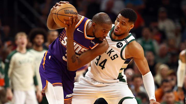 Mar 24, 2025; Phoenix, Arizona, USA; Milwaukee Bucks forward Giannis Antetokounmpo (34) defends against Phoenix Suns forward Kevin Durant (35) at Footprint Center. Mandatory Credit: Mark J. Rebilas-Imagn Images
