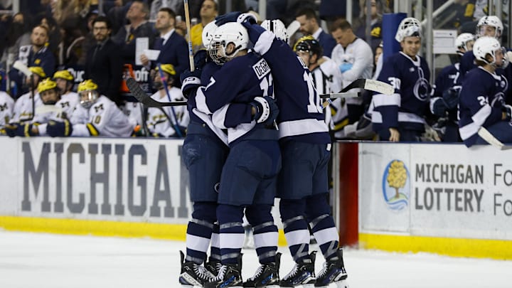 The Penn State Nittany Lions celebrate a goal against Michigan in the Big Ten men's hockey tournament. 