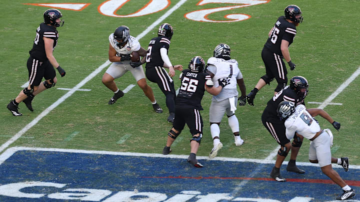Jan 1, 2026; Miami Gardens, FL, USA; Oregon Ducks linebacker Matayo Uiagalelei (10) forces the fumble on Texas Tech Red Raiders quarterback Behren Morton (2) during the second half of the 2025 Orange Bowl and quarterfinal game of the College Football Playoff at Hard Rock Stadium. Mandatory Credit: Nathan Ray Seebeck-Imagn Images