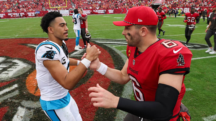 Dec 29, 2024; Tampa, Florida, USA; Tampa Bay Buccaneers quarterback Baker Mayfield (6) great Carolina Panthers quarterback Bryce Young (9) after a game at Raymond James Stadium. Mandatory Credit: Nathan Ray Seebeck-Imagn Images