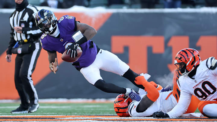 Dec 14, 2025; Cincinnati, Ohio, USA;  Baltimore Ravens quarterback Lamar Jackson (8) is sacked by Cincinnati Bengals defensive tackle Jordan Jefferson (94) during the third quarter at Paycor Stadium. Mandatory Credit: Joseph Maiorana-Imagn Images