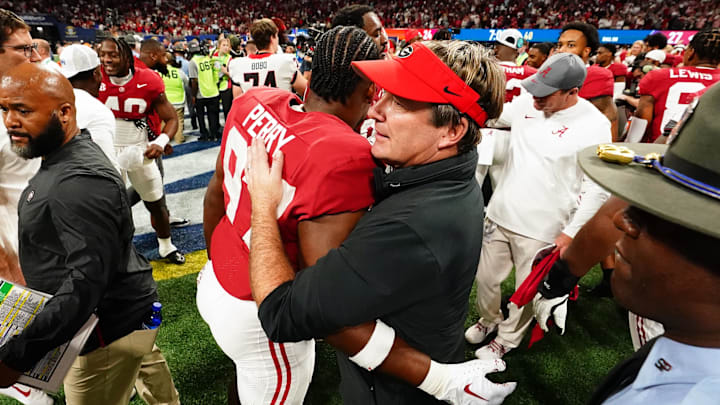 Dec 2, 2023; Atlanta, GA, USA;  Georgia Bulldogs head coach Kirby Smart embraces Alabama Crimson Tide defensive lineman Khurtiss Perry (97) after the Alabama Crimson Tide defeated the Georgia Bulldogs in the SEC Championship at Mercedes-Benz Stadium. Mandatory Credit: John David Mercer-Imagn Images