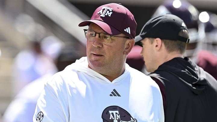 Texas A&M Aggies head coach Mike Elko walks on the field prior to the game against the Auburn Tigers at Kyle Field. Texas A&M Aggies head coach Mike Elko walks on the field prior to the game against the Auburn Tigers at Kyle Field.