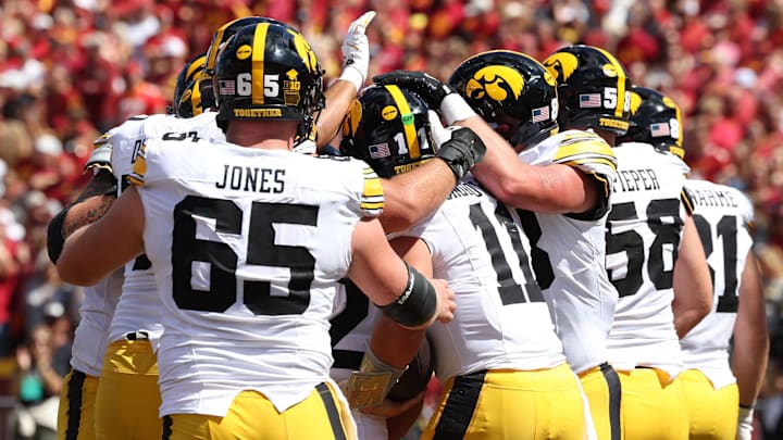 Sep 6, 2025; Ames, Iowa, USA; The Iowa Hawkeyes celebrate after quarterback Mark Gronowski (11) scored a touchdown against the Iowa State Cyclones during the second quarter at Jack Trice Stadium. Mandatory Credit: Reese Strickland-Imagn Images