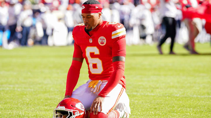 Nov 10, 2024; Kansas City, Missouri, USA; Kansas City Chiefs safety Bryan Cook (6) kneels on field against the Denver Broncos prior to a game at GEHA Field at Arrowhead Stadium. Mandatory Credit: Denny Medley-Imagn Images
