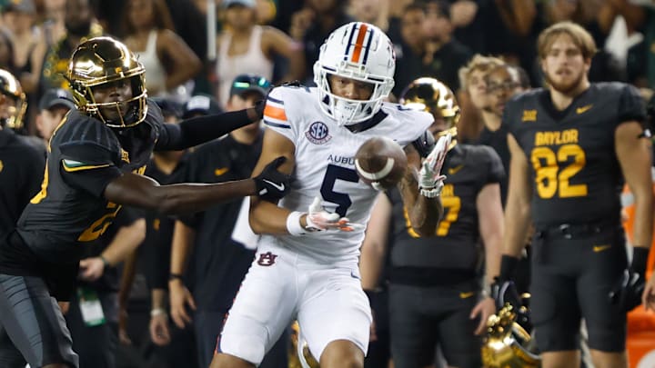 Aug 29, 2025; Waco, Texas, USA;  Auburn Tigers wide receiver Horatio Fields (5) catchesa pass against Baylor Bears safety Cameren Jenkins (23) during the second half at McLane Stadium. Mandatory Credit: Chris Jones-Imagn Images