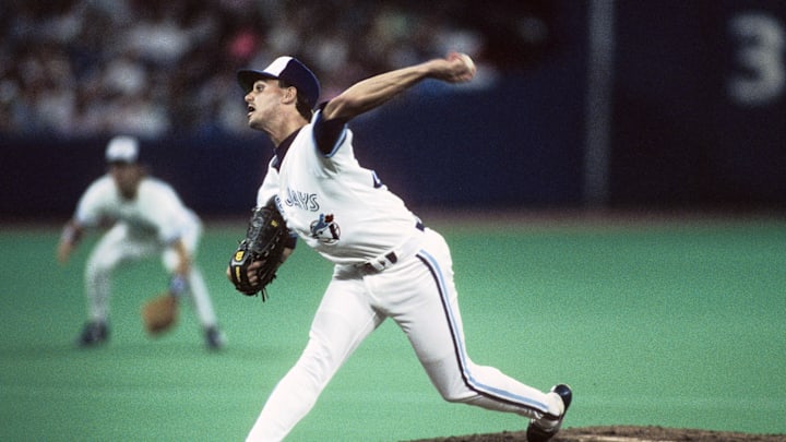 Former Toronto Blue Jays pitcher Jimmy Key throws a pitch wearing a white jersey.