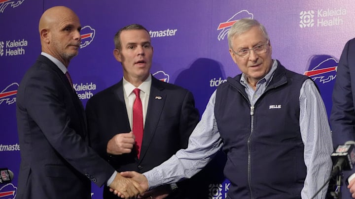 Pete Guelli, president of business operations, Brandon Beane, president of football operations and general manager, shake hands with owner and president Terry Pegula after a group photo on Jan. 29, 2026 Pete Guelli, president of business operations, Brandon Beane, president of football operations and general manager, shake hands with owner and president Terry Pegula after a group photo on Jan. 29, 2026