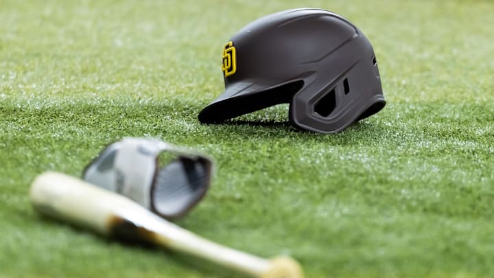 Jun 13, 2025; Phoenix, Arizona, USA; Detailed view of a San Diego Padres batting helmet and baseball bat on the field at Chase Field. Mandatory Credit: Mark J. Rebilas-Imagn Images Jun 13, 2025; Phoenix, Arizona, USA; Detailed view of a San Diego Padres batting helmet and baseball bat on the field at Chase Field. Mandatory Credit: Mark J. Rebilas-Imagn Images