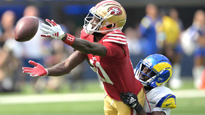 Sep 22, 2024; Inglewood, California, USA;  Los Angeles Rams cornerback Tre'Davious White (27) defends San Francisco 49ers wide receiver Brandon Aiyuk (11) on a pass play in the first half at SoFi Stadium. Mandatory Credit: Jayne Kamin-Oncea-Imagn Images