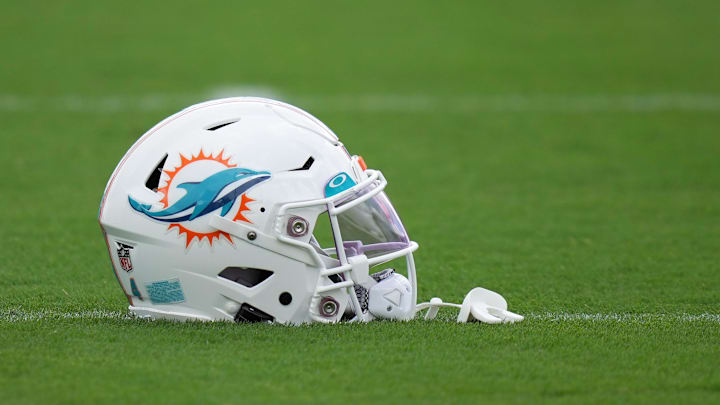 Aug 3, 2022; Miami Gardens, Florida, US; A general view of a Miami Dolphins helmet on the field during training camp at Baptist Health Training Complex. Mandatory Credit: Jasen Vinlove-Imagn Images